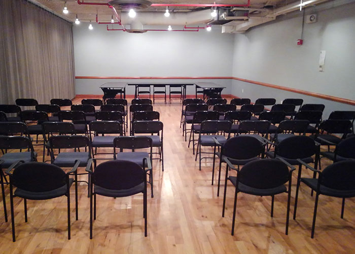 Photo of a room with a table and chairs.